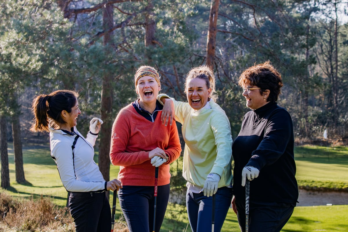 Female golfers laughing on the course. Photo_ Renate Roeleveld